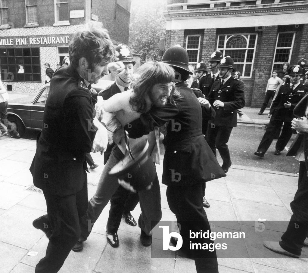 The Battle of Red Lion Square. Police try to keep opposing demonstrators apart. Trouble flared up when members of the National Front clashed with supporters of various left wing groups who had gathered in the square following Roy Jenkins the Home Secretary decision to grant amnesty to a number of illegal immigrants. One demonstrator died in the clashes. 16th June 1974 (b/w photo)