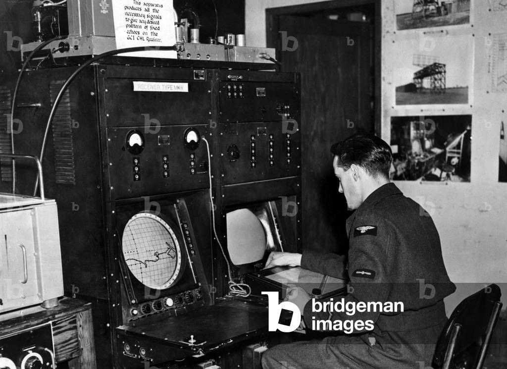 Ground control interception which is used to inform night fighters of enemy aircraft at a radar research station in Great Malvern during the Second World War, 1945 (b/w photo)