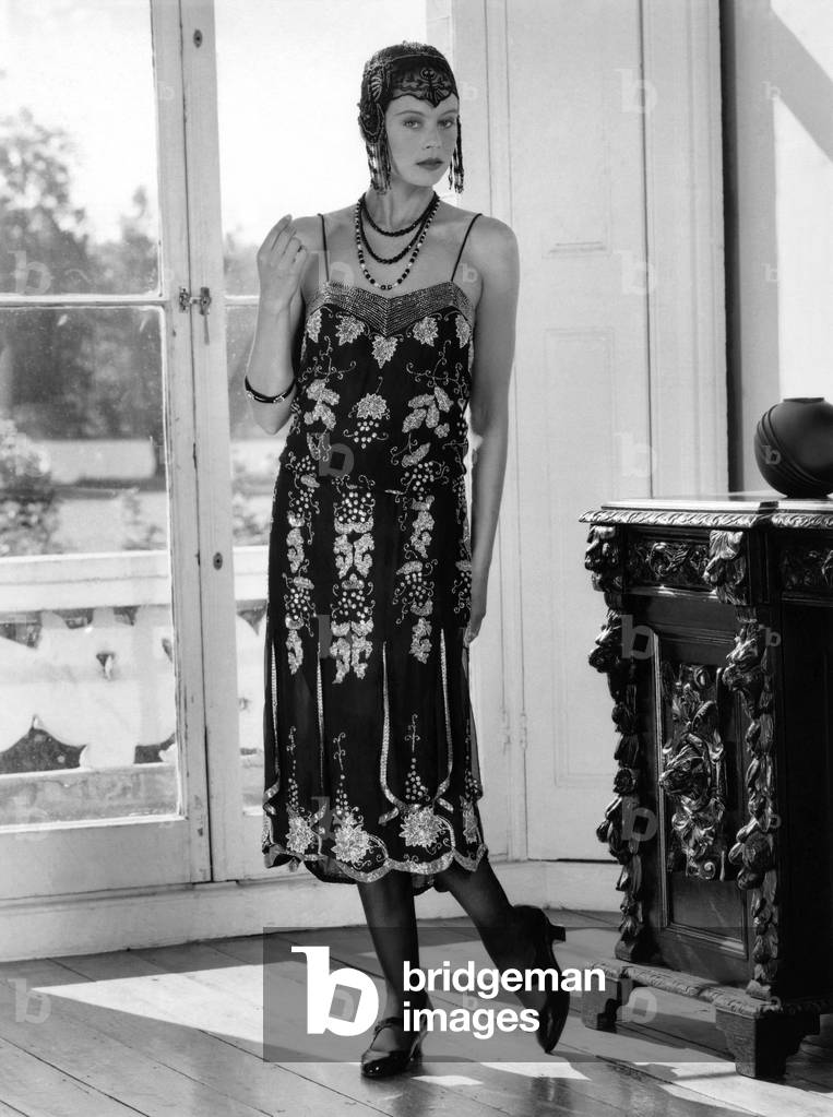Fashions 1920's: Beaded flapper dress and skull cap with neat T-bar shoes. October 1987