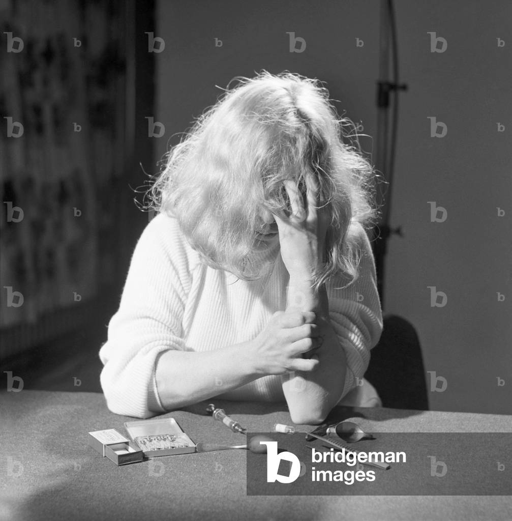 Model shot: Drug addict seen here taking drugs. 1960