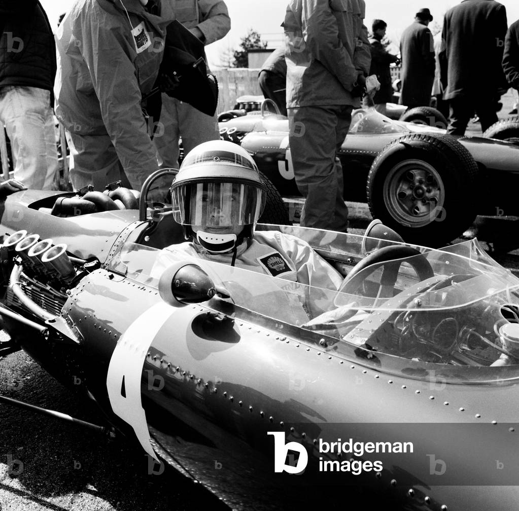 Goodwood International Race Meeting, Easter Monday. A driver in the main race, the Sunday Mirror Trophy, car number 4. 19th April 1965 (b/w photo)