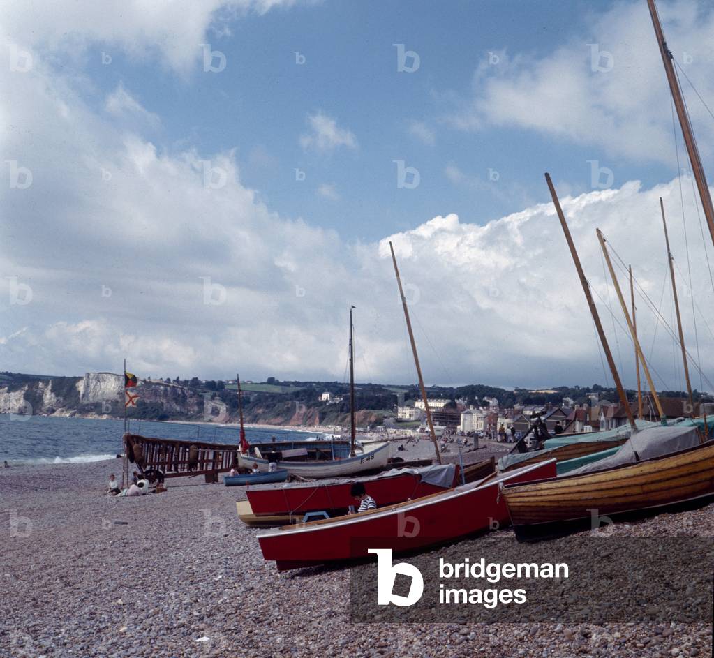Boats on the beach in the small seaside town of Seaton on the South Devon coast, circa 1966.
