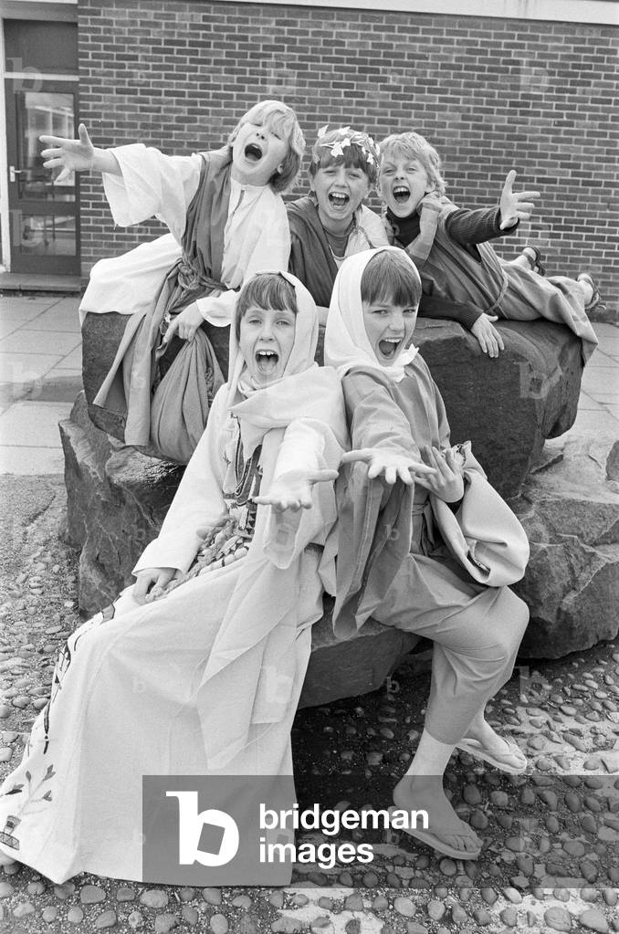 Proclaiming the message... these budding thespians took part in a special Easter production of The Man from Galilee at Meltham C of E School. From left (back): Joseph Yeadon, Simon Ball and Ben Curtis. Front: Lyndsay Uppadine and Alison Wrathall. Forty-two children staged the show twice, once for pupils and once for parents. The pianist was Mrs Pam Riding and music teacher Mrs Joyce Dunn produced the show, helped by staff and parents. 25th March 1986 (b/w photo)