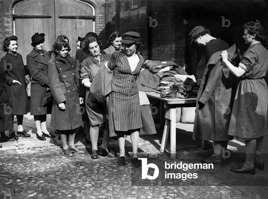 Army Class ATS girls trying on outfits. 
March 1942
