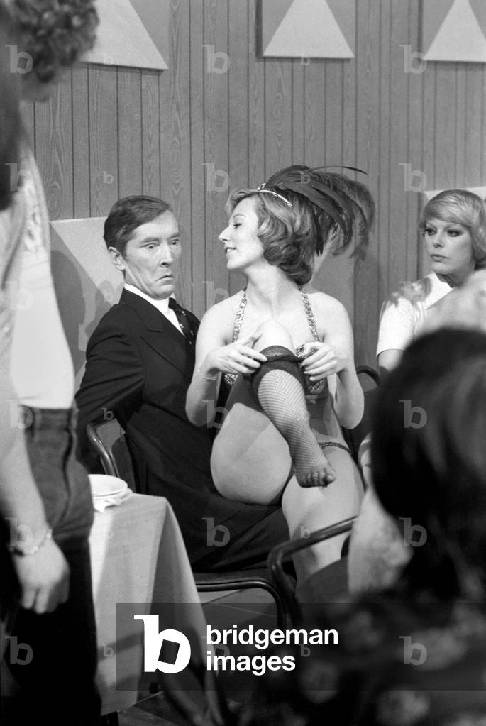 Pinewood Studios for film 'Carry on Behind', Jenny Cox a comedy actress who had to learn how to do a Strip Tease specially for a scene in the film, March 1975 (b/w photo)
