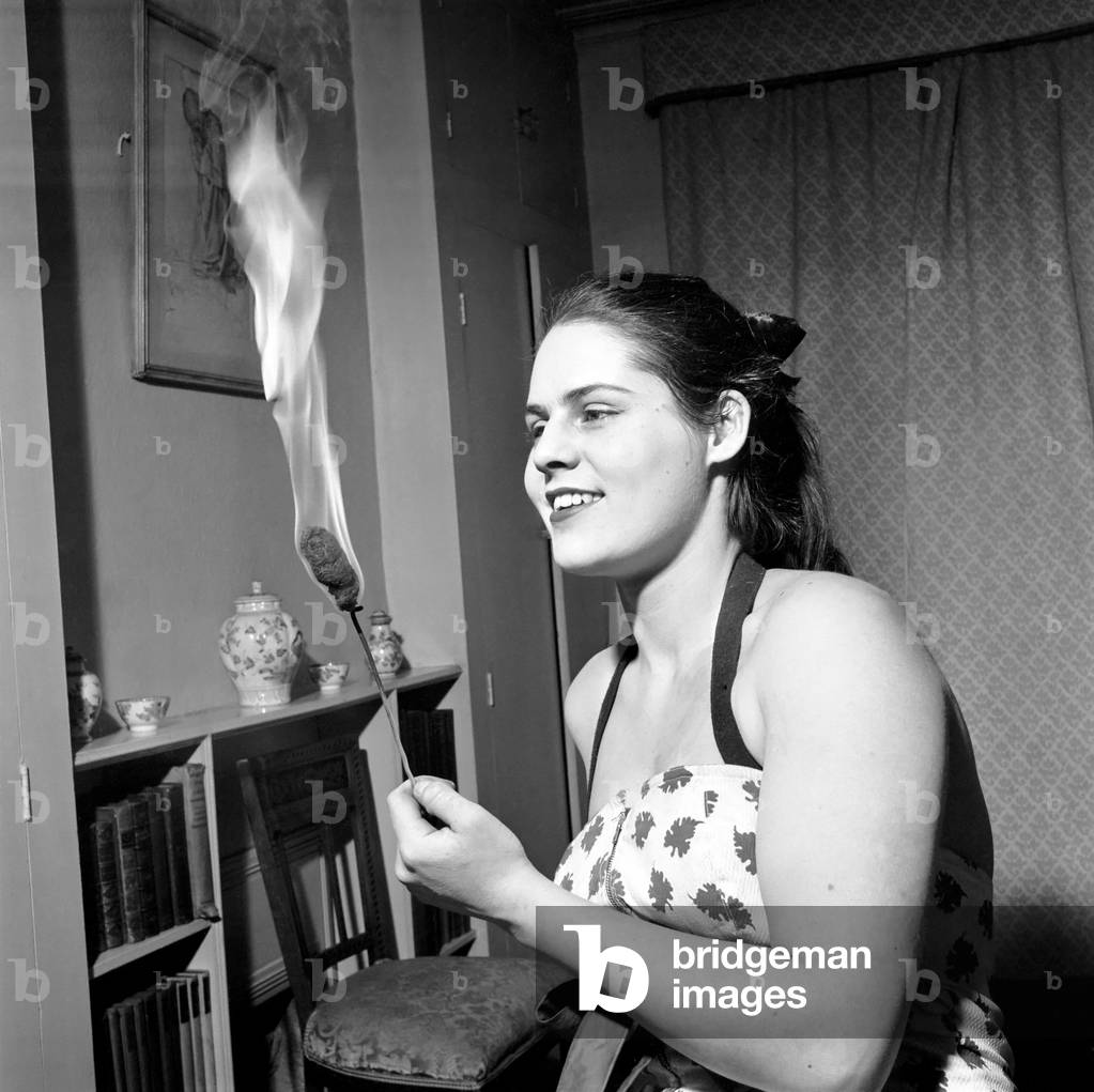 Priscilla Birt female fire eater, January 1957 (b/w photo)