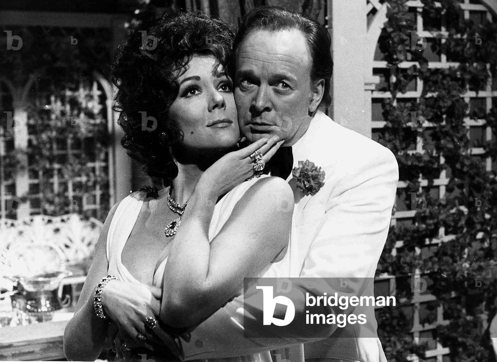 Actress Diana Rigg with Tony Britten playing the parts of Elizabeth Taylor and Richard Burton for a television programme 1977 (b/w photo)
