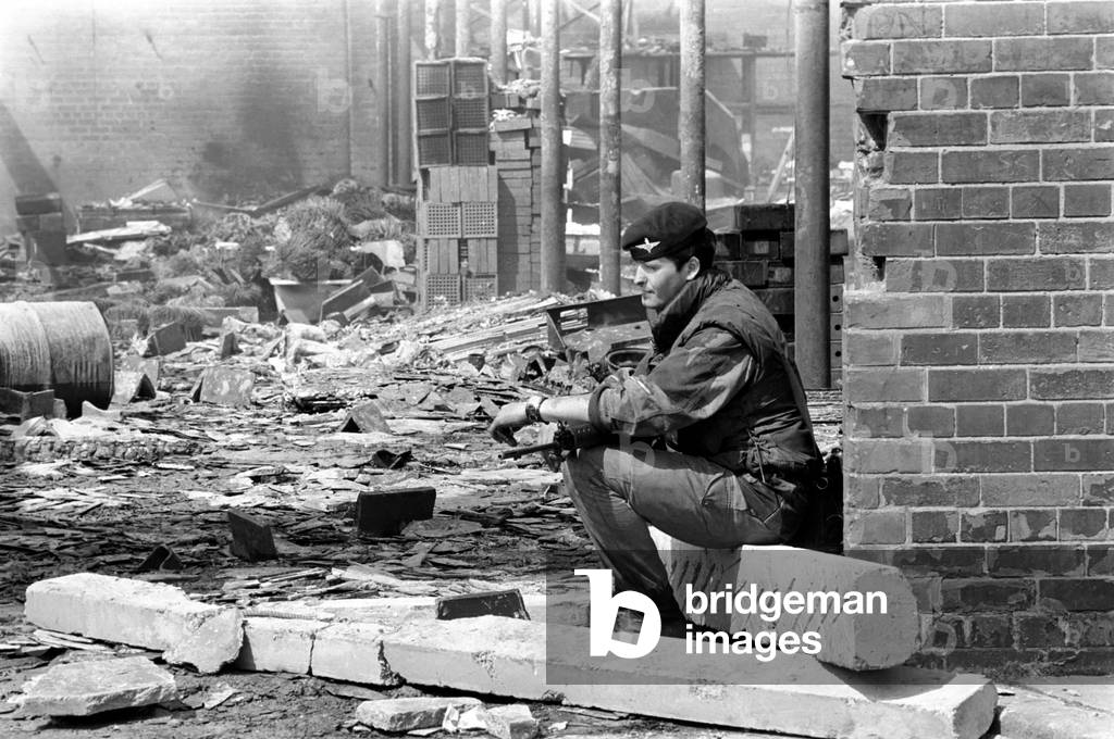 Northern Ireland August 1971. Soldiers, fireman and local residents survey the damage following rioting on the streets of Belfast. August 1971 71-8167-013