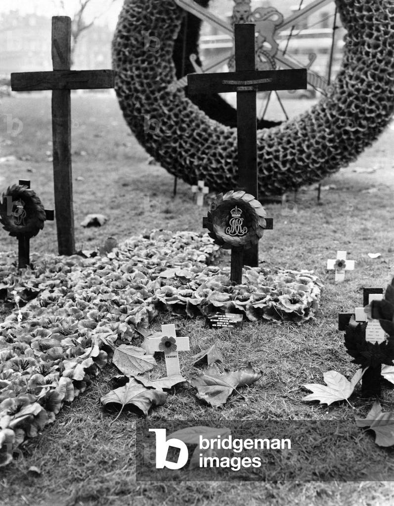 Many People visited the empire field of remembrance in St. Margaret's Churchyard, Westminster, To-day to plant a poppy in memory of someone dear to them. Pic 7-11-53. The cross planted in memory of the Late Queen Mary, By Major General Sir Richard Howard-Vyse, K.C.N.G., D.S.O. colonel of the Royal Horse guards, November 1953