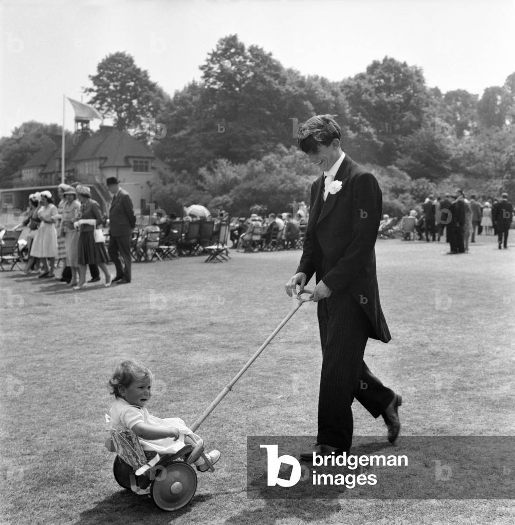 15 year old Hugh Pryor the Eton Boy from Reading with 12 months old Isabel his niece in the pram. And suddenly she started screaming. 
June 1960