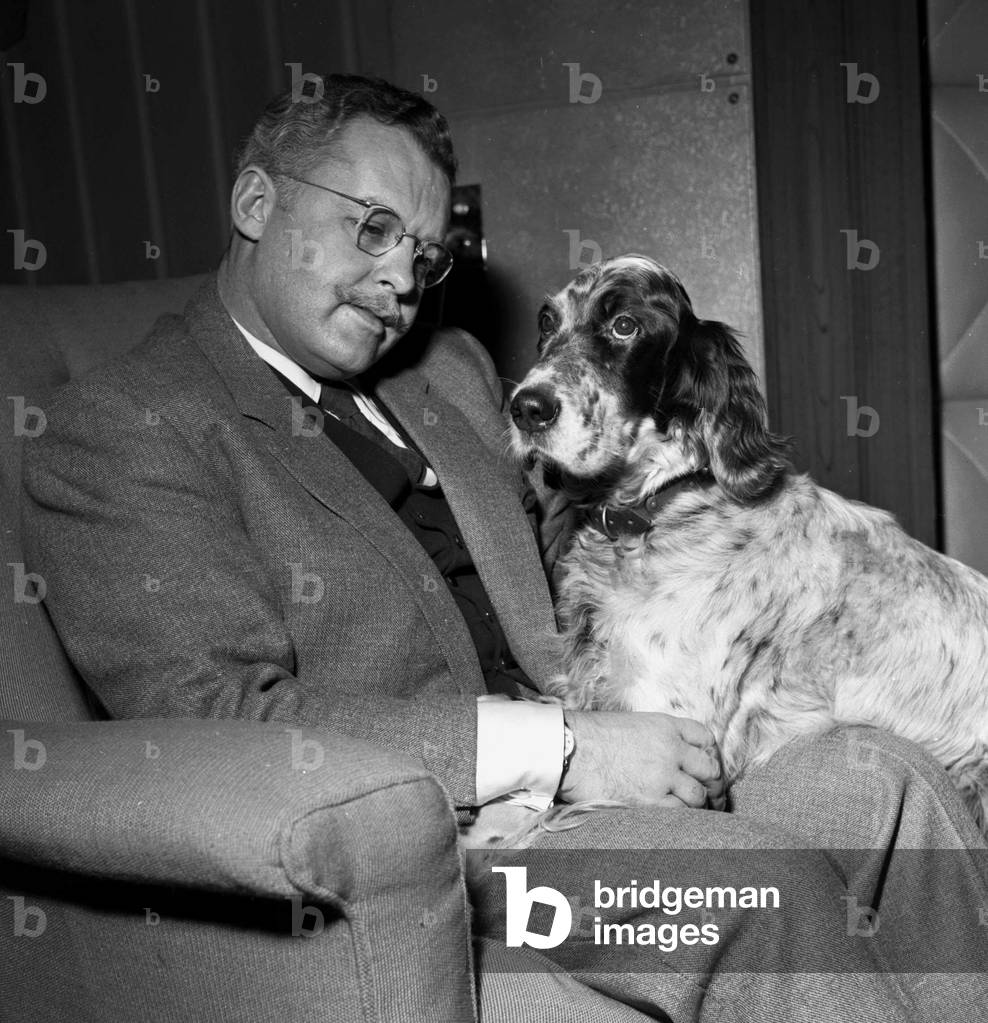 Actor Rod Steiger with his pet springer spaniel February 1957 (b/w photo)