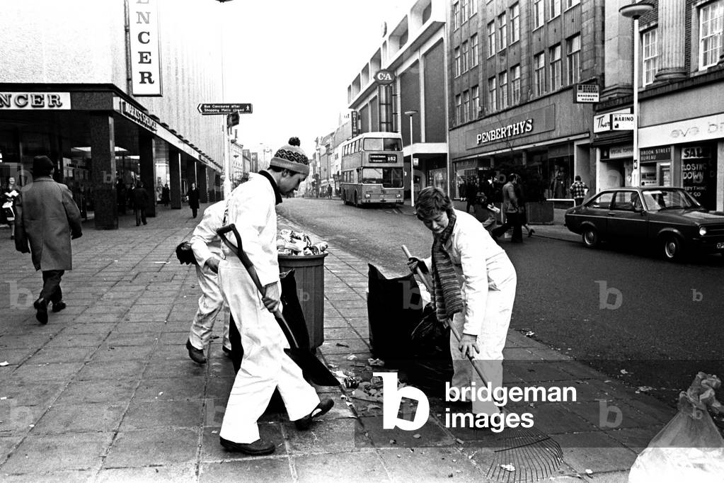 The Moonies clearing up the litter and rubbish on Northumberland Street, Newcastle during the strike by rubbish collectors on 7th February 1979 (b/w photo)