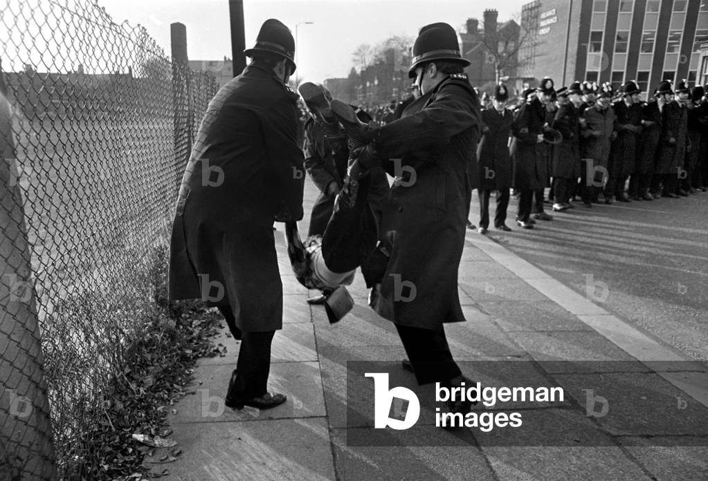Police arrest protesting students in Talbot Road behind White City, who have gathered in a demonstration against the visit of the South African rugby team and the apartheid system. November 1969