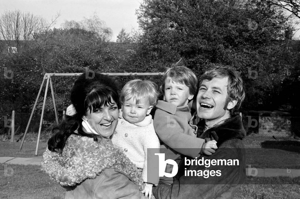 Family pictures of Alan and Maureen Rothwell, with babies Tody aged 2 years and Ben aged 16 months, playing on the swings and slides at their local play ground. 
November 1969