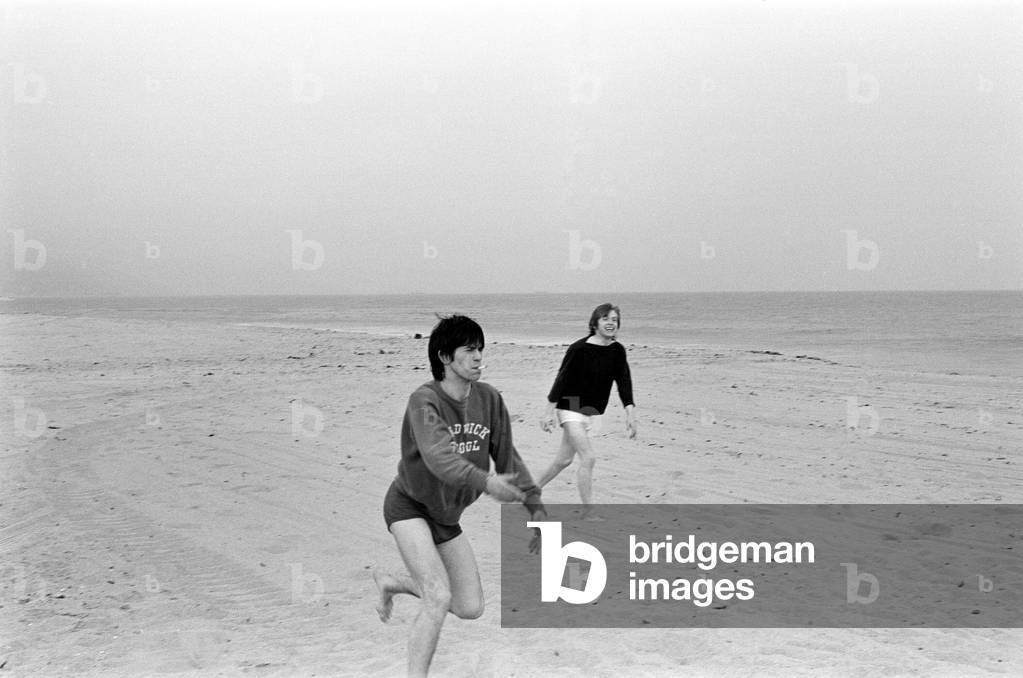 The Rolling Stones. Keith Richards and Brian Jones seen here posing on Malibu beach. According to the photographers 