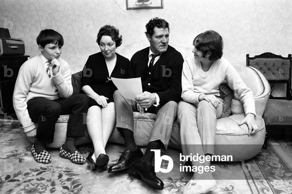 Tommy Cooper, pictured at home with family, wife Gwen, son Thomas and daughter Vicky, January 1967.