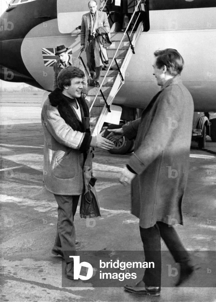 Albert Finney seen here being greeted on the apron of Manchester airport. Finney is in the final weeks of filming his new film 