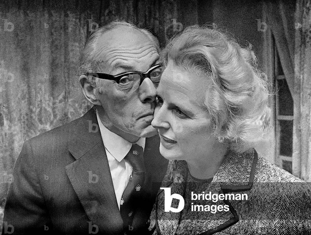 Margaret Thatcher with Denis Thatcher who kisses her on the cheek, February 1975 (b/w photo)