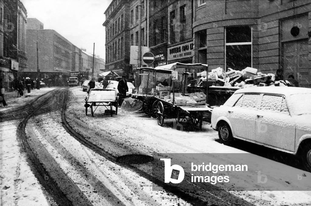 Street traders trying to do business on the wintry streets of Newcastle on 7th December 1973 (b/w photo)