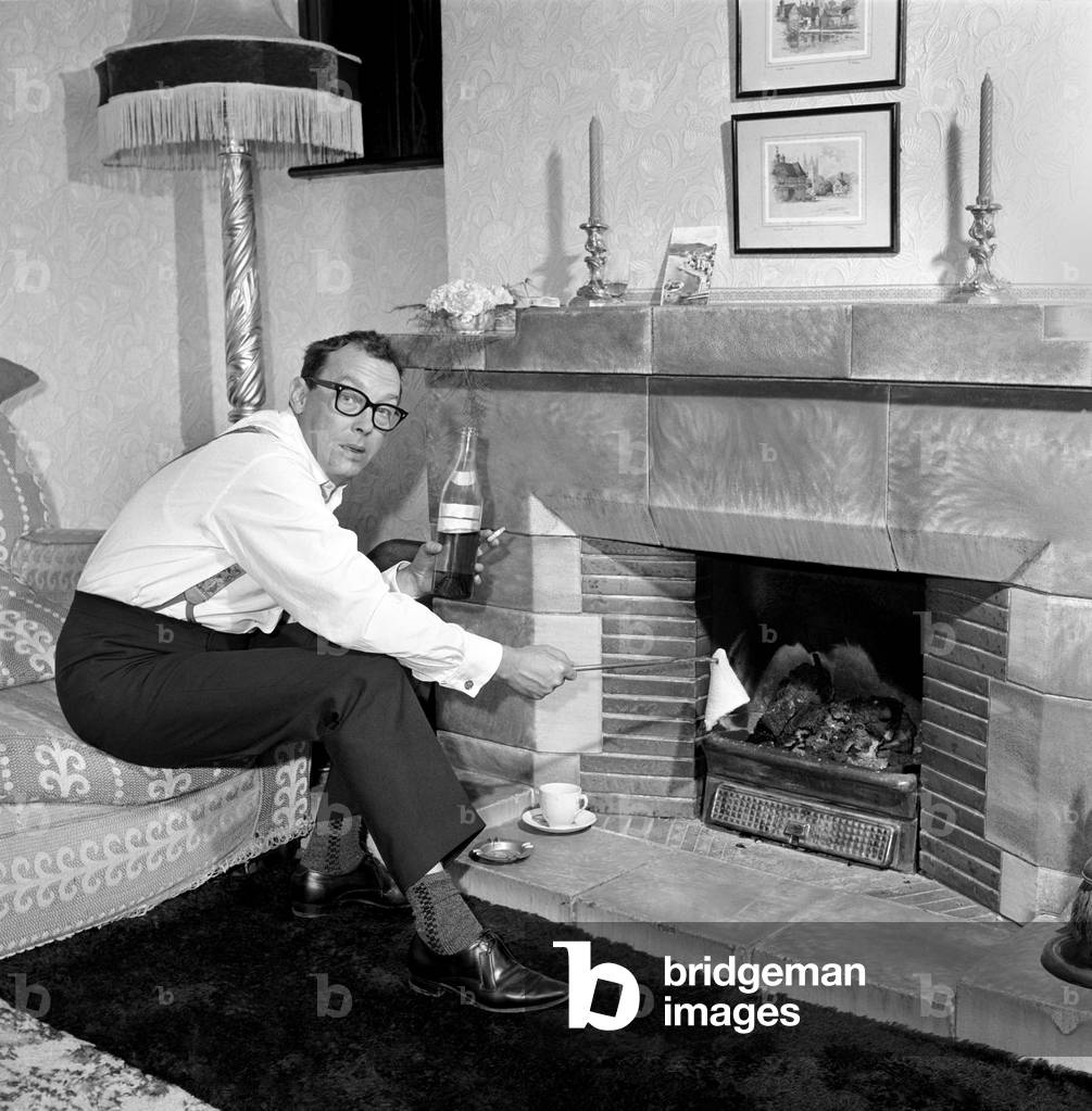 Eric Morecambe seen here at home, 1963 (b/w photo)