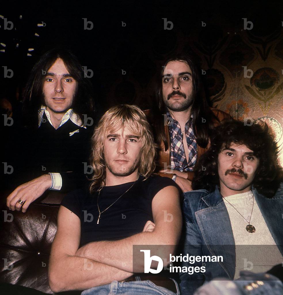 Status Quo Rock Group Francis Rossi and with Rick Parfitt and other members of the band, February 1977 (photo)