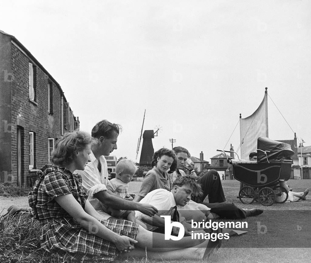 Villagers gather beside the village green at Meopham, Kent to watch their local cricket team in action Circa June 1950