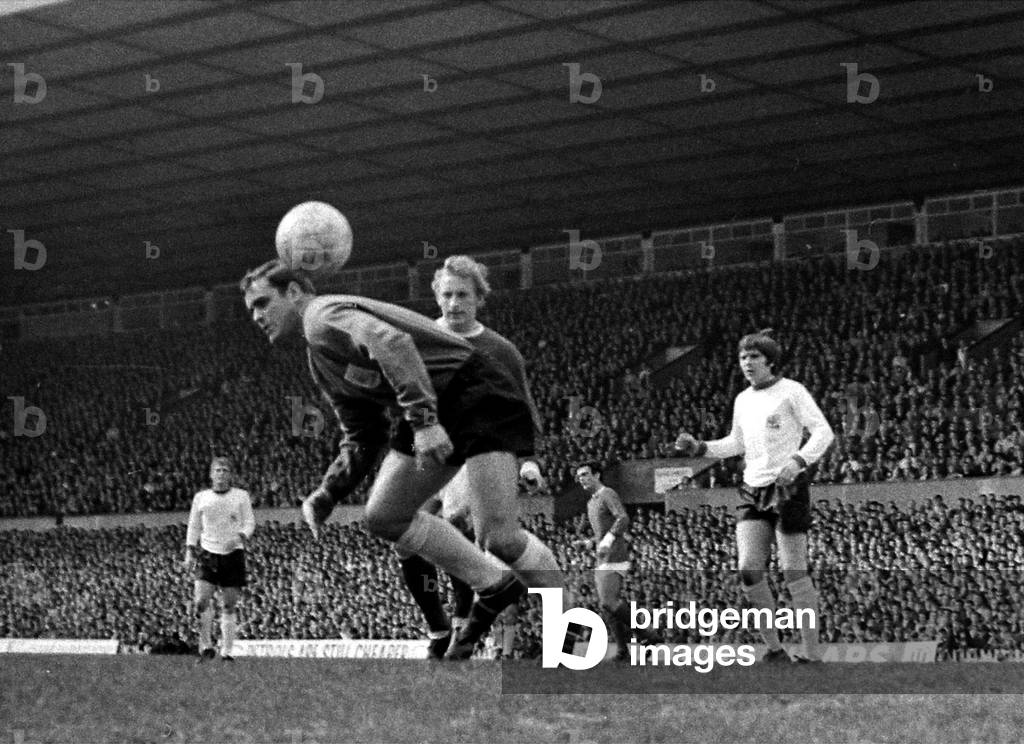 Denis Law of Manchester United putting pressure on Sheffield United goalkeeper Alan Hodgkinson during their league match at Old TraffordApril 1968 (photo)