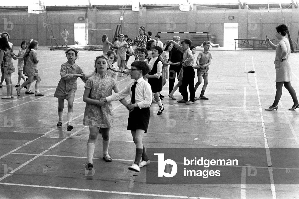 School children take part in an end of school year dance at the Lightfoot Stadium in Walker organised by the English Folk Dance Society 3 June 1970 (b/w photo)