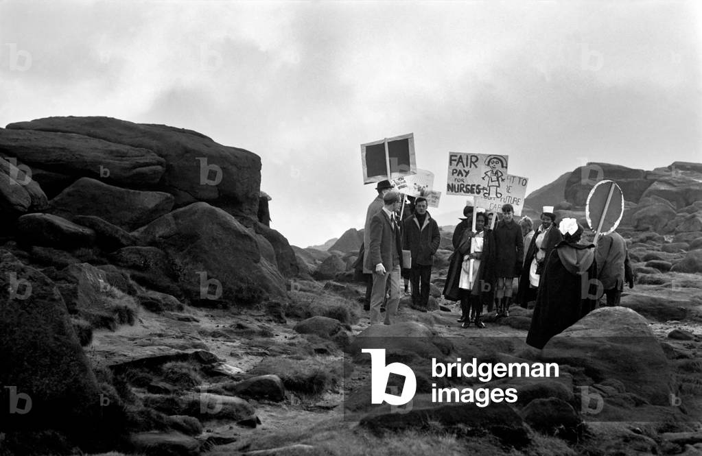 Nurses campaigned for more pay near Ilkley when they marched from the town centre to the Cow & Calf Rocks high on the Ilkley moors where they intend to camp. Pictures show the nurses on their way to the Cow and Calf Rocks
December 1969