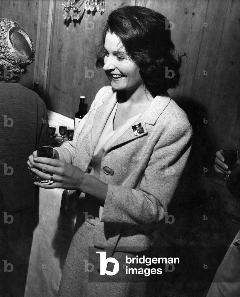 Lady Astor handing out sherry at a conference of British Organisations for aid to Refugees. 23rd May 1962.
