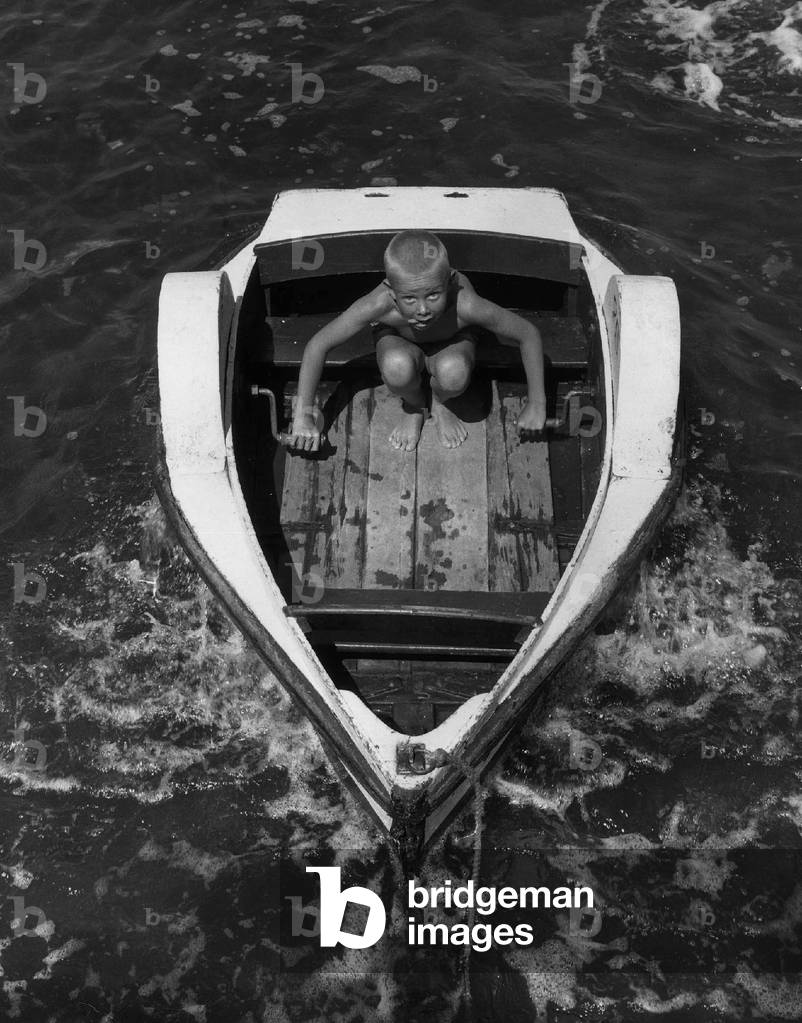 Young Keith Little from Chelmsford sails away in his paddle boat holiday
 August 1963