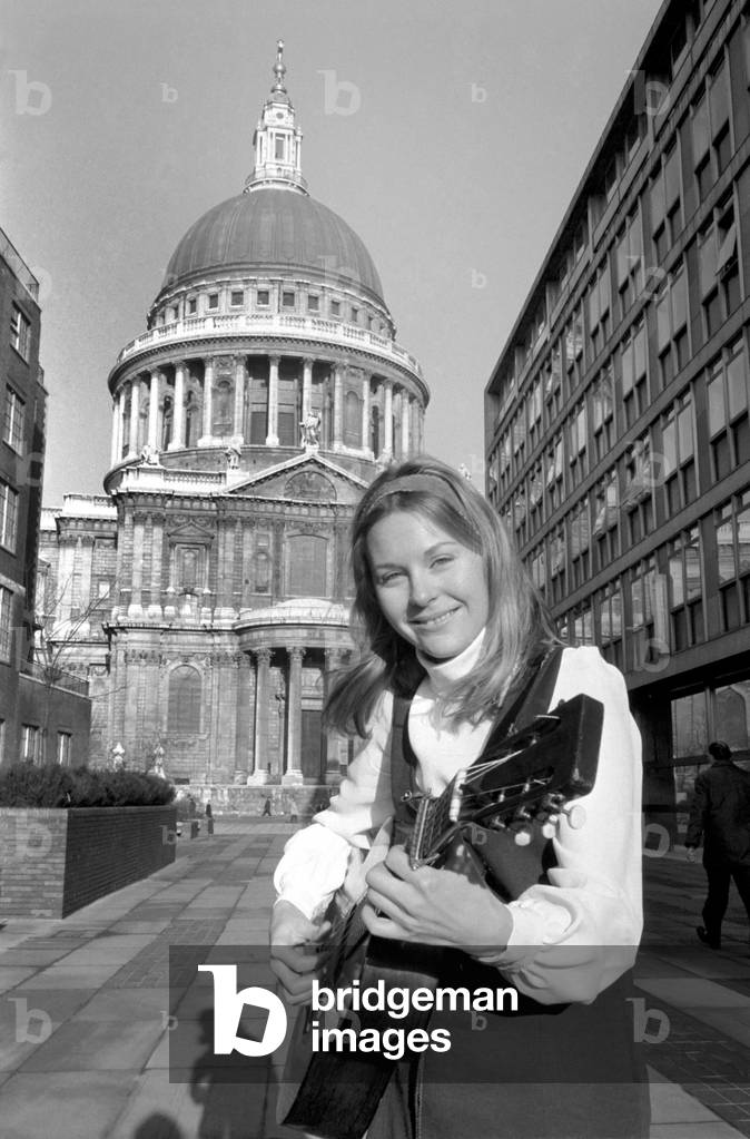 Folk singer Suzanne Harris pictured outside St. Pauls a few minutes before her performance. when she sang to a lunch time audience inside
December 1969