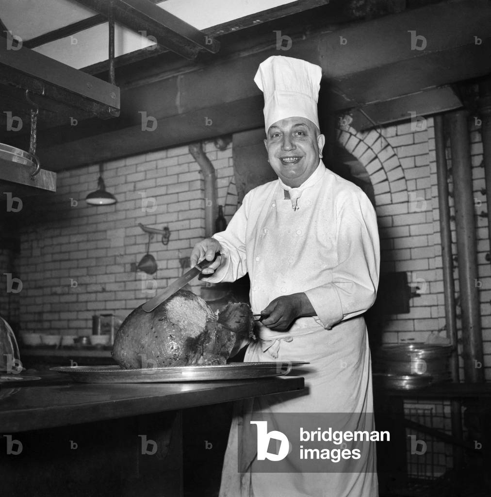 Monsieur Alban, lead chef at Savoy Hotel, with turkey. December 1949 O21983