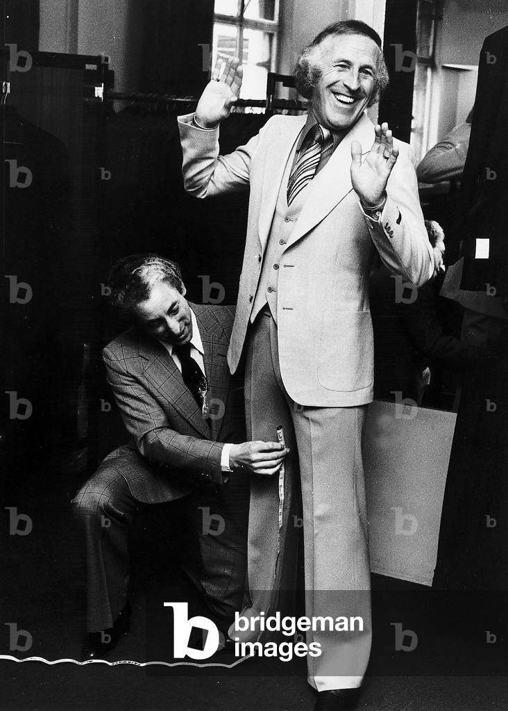 Bruce Forsyth Entertainer being measured up for a new suit, 09/05/1976
