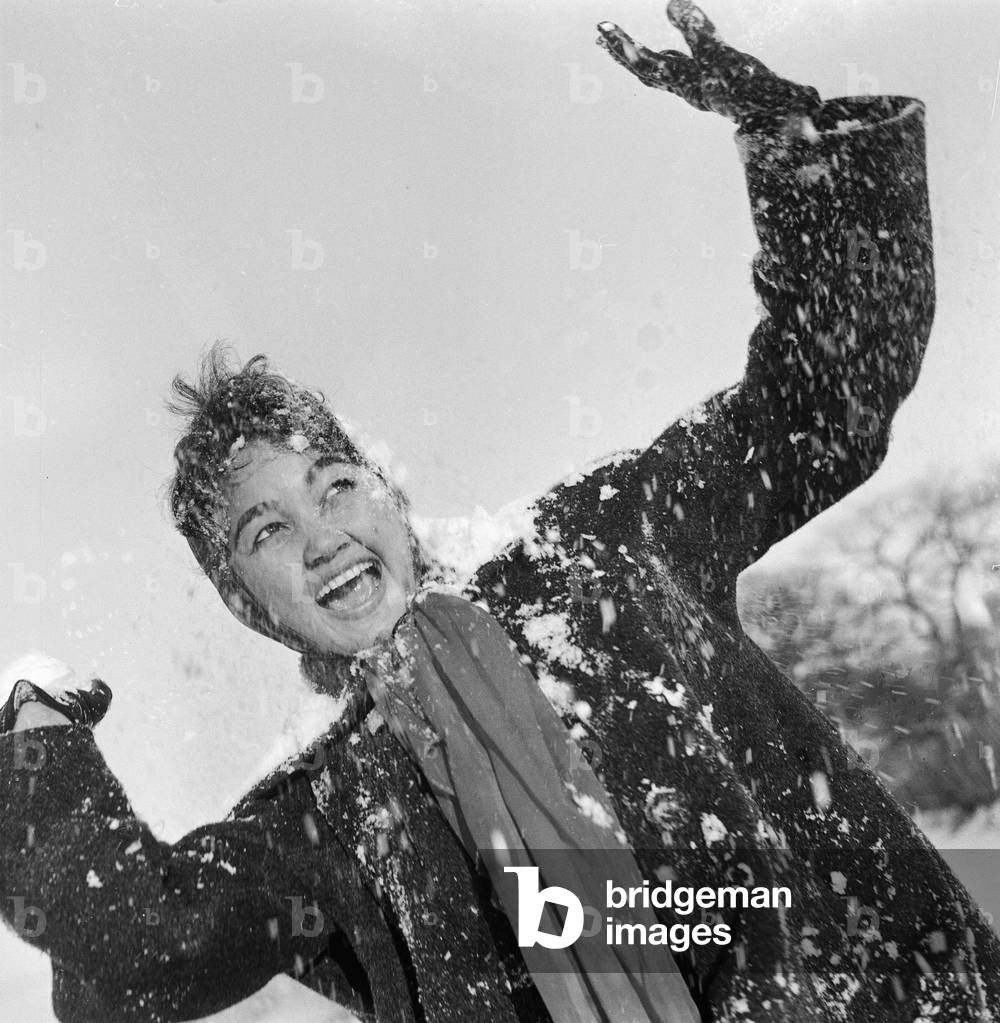 Philippine dancers have a snowball fight in London,10th January 1960 (b/w photo)