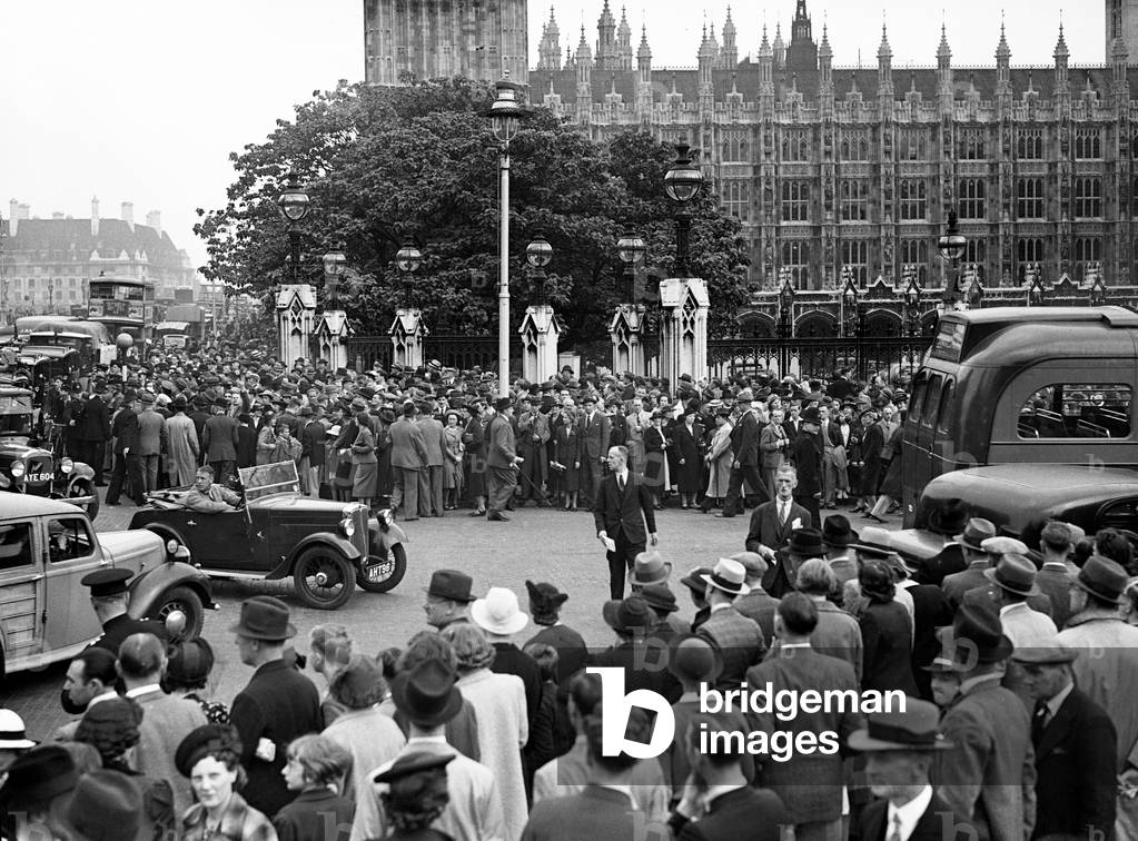 Large crowds gather outside the Houses of Parliment for news following Germany's invasion of Poland, 1st September 1939 (b/w photo)