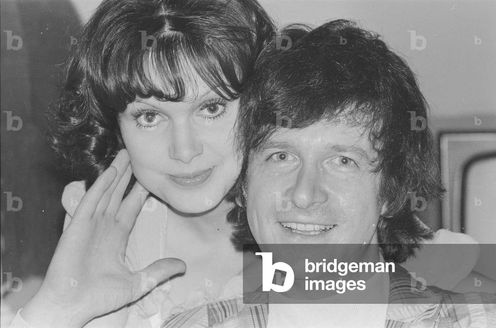 Actress Madeline Smith pictured at home with her boyfriend film actor David Buck. 10th August 1975 (b/w photo)
