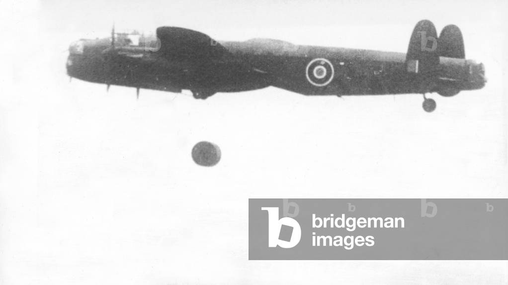 A specially adapted Avro Lancaster carrying out a live testing of a Barnes Wallis bouncing bomb off the coast at Reculver, Kent, 1943 (b/w photo)