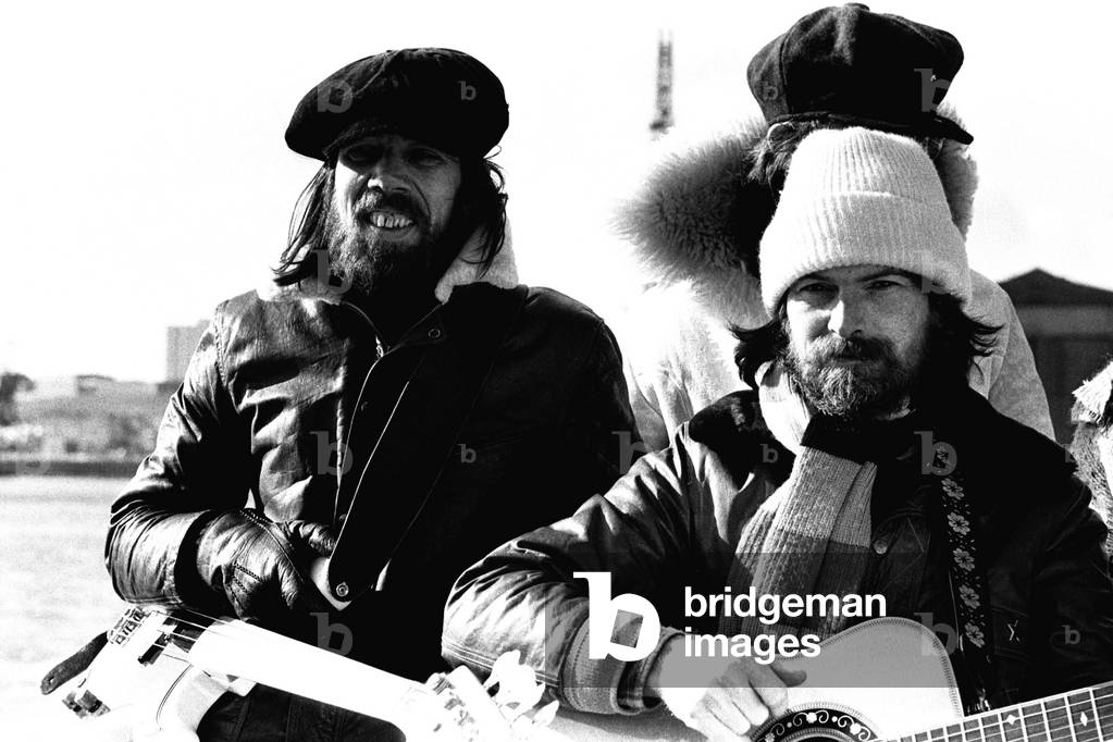 Lindisfarne sailed down the Tyne on a musical journey. The group were filming on board a Tyne ferry for a half-hour television show called 'All Right Now'. Rod Clements and Si Cowe pictured. 4th March, 1979 (b/w photo)