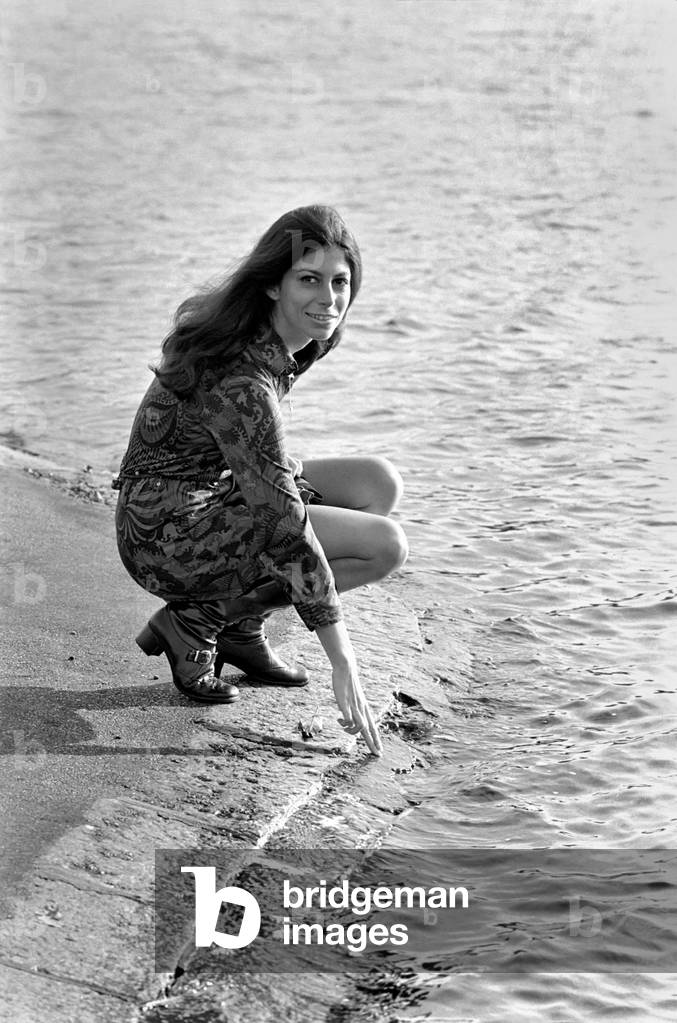 Making use of a sunny day in late November is actress and model, Ann Collins (23) who is walking in Kensington Garden. November 1969