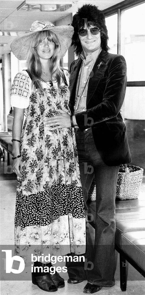 Ronnie Wood of the Rolling Stones with wife Chrissie are pictured leaving London Heathrow Airport heading for Los Angeles. August 1976