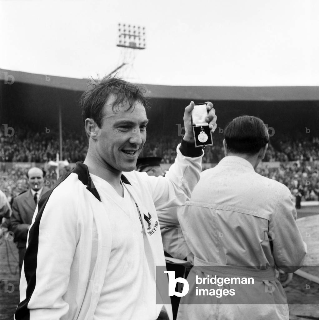 FA Cup final at Wembley StadiumTottenham Hotspur 3 v. Burnley 1. Spurs striker Jimmy Greaves holds up his winners medal at the endMay 1962 Q3891-032 (photo)