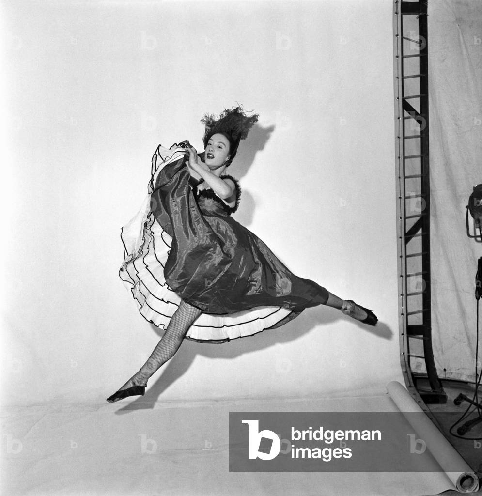 Ballet dancer performing the can can
December 1953