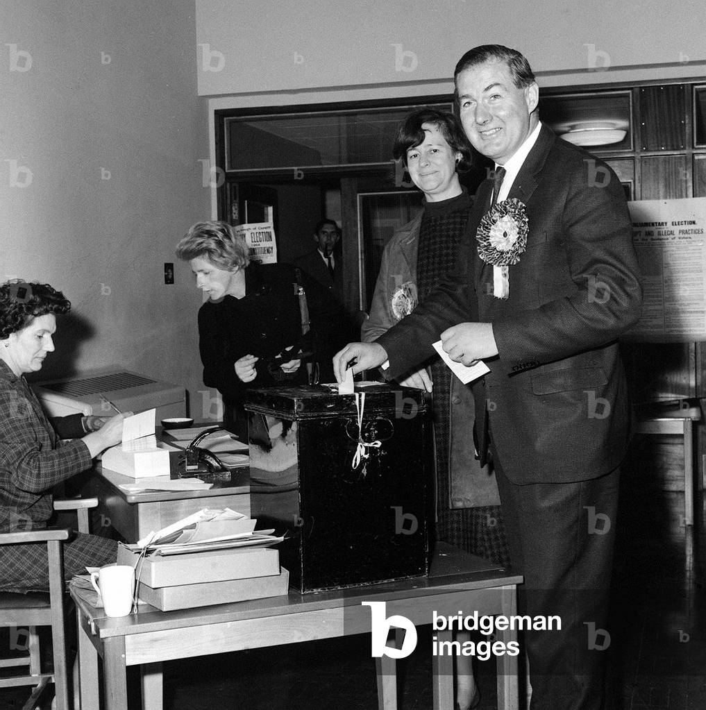 Jim Callaghan MP and his wife cast their vote in the General Election at Penyrheol School, Llanrumney near Cardiff, October 1964 (b/w photo)