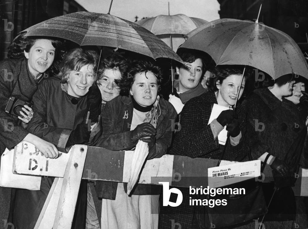 A group of girls who waited in the rain to greet their idols outside the Birmingham Hippodrome, the Beatles. 10th November 1963.