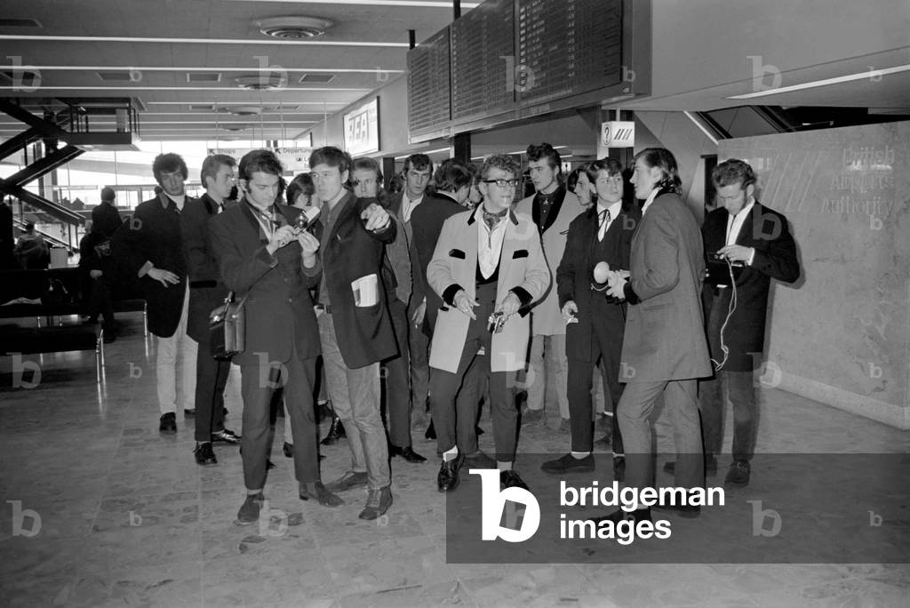 Rock and Roll American pop singer Gene Vincent arrives at Heathrow Airport from Paris. He was met at the airport by a crowd of 1955-style Teddy boys. 
November 1969