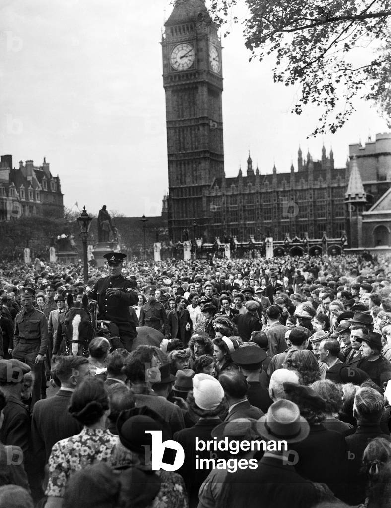 VE Day celebrations in London at the end of the Second World War. Some of the huge crowd gathered in Whitehall for the celebrations., 8th May 1945 (b/w photo)