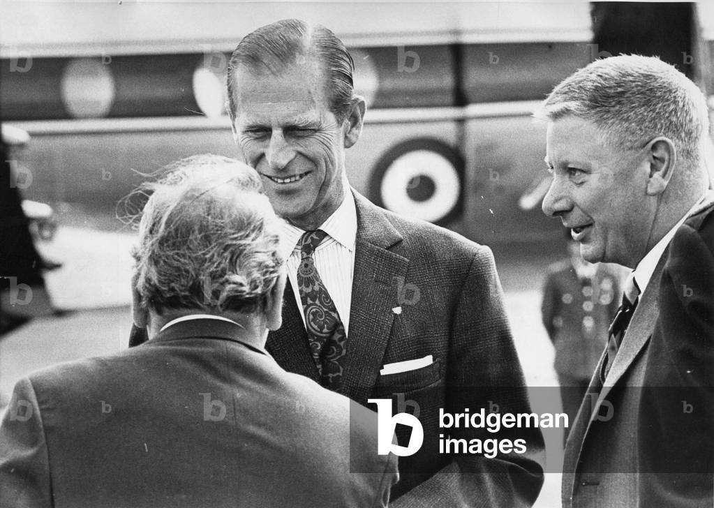 Prince Philip, Duke of Edinburgh, lands at Usworth Airport and is greeted by Mr S C Bacon, MD of Royal Ordnance Factories and Mr R J MacDonald director of the Royal Ordnance Factory, Birtley, 11/05/1972