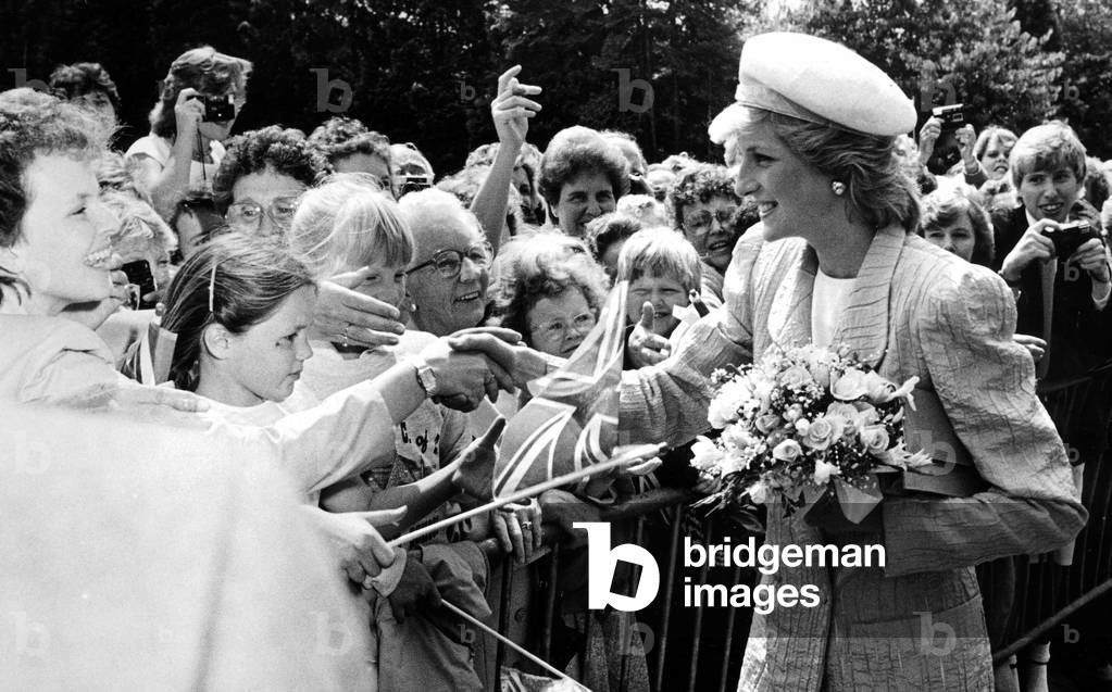 Diana, Princess of Wales during a visit which took in Southfields, a group of sheltered homes for the elderly in Leamington, lunch at the Judges' House followed by a visit to the castle in Warwick. She is seen here during the Leamington part of the tour. 8th July 1986 (b/w photo)