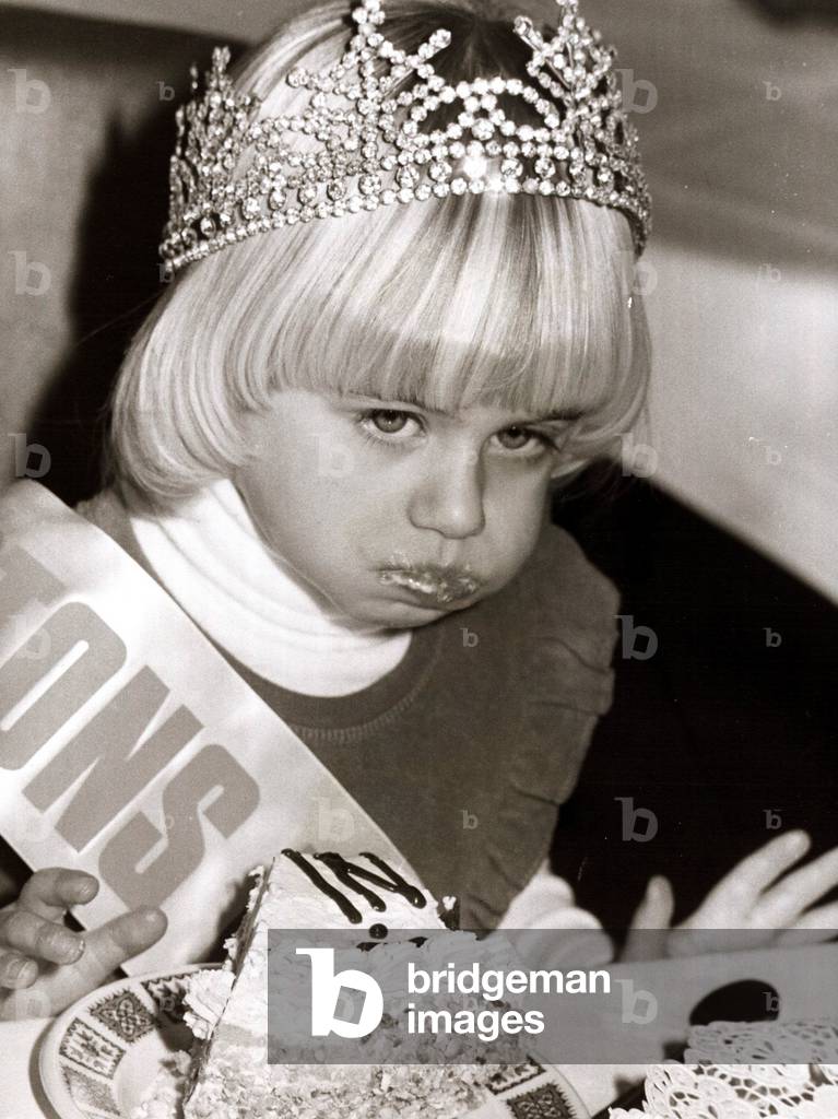 Mini Miss United Kingdom, four year old Yvette Cowherd of Broxbourne, stuffs herself with cake after winning her crown
January 1978